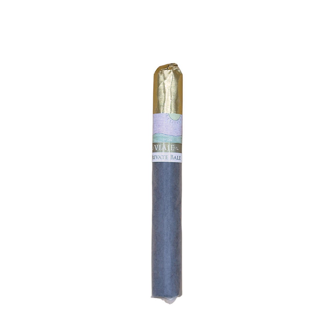 Cigar with a blue wrapper and gold band on a white background