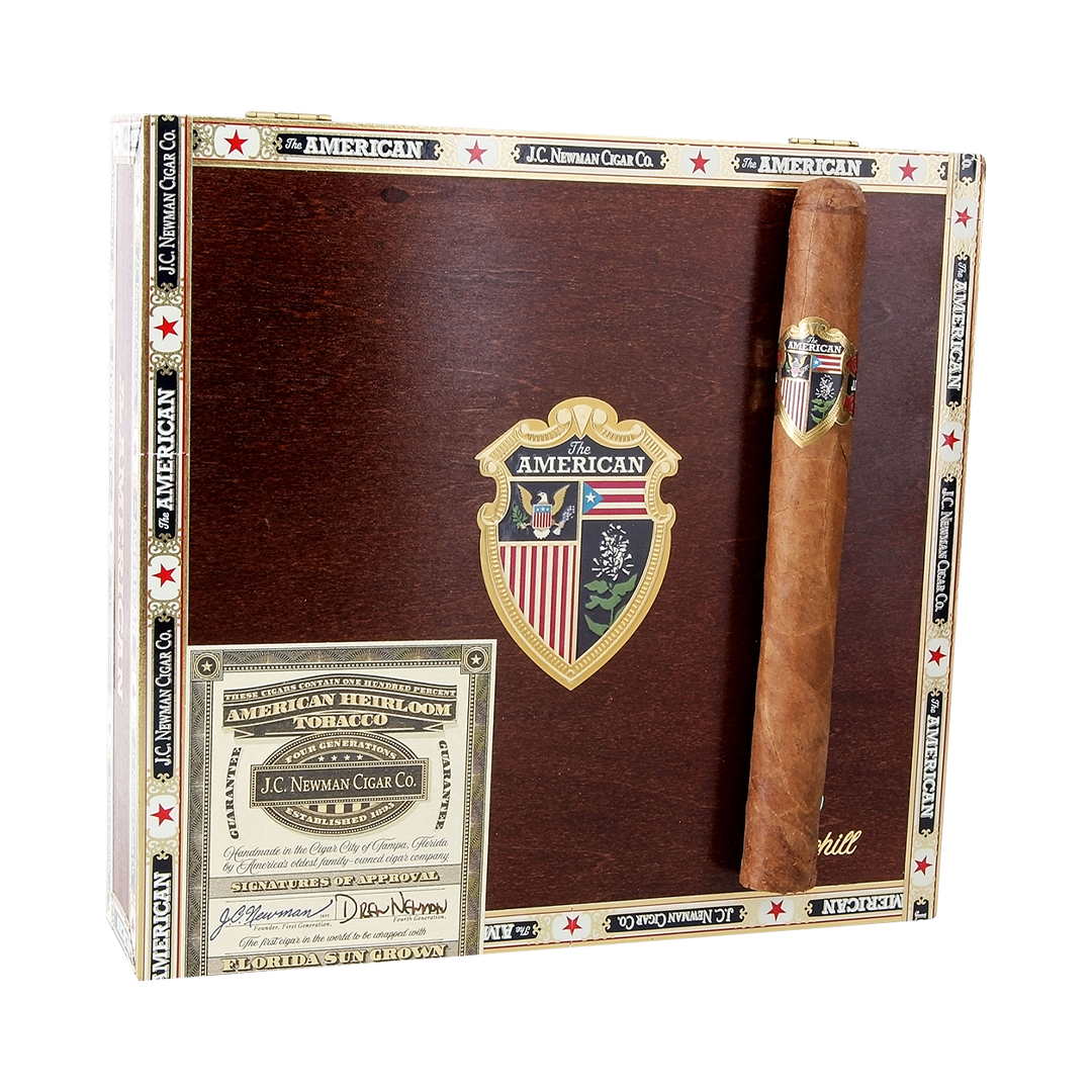 Cigar box with a cigar inside, featuring branding and decorative elements.