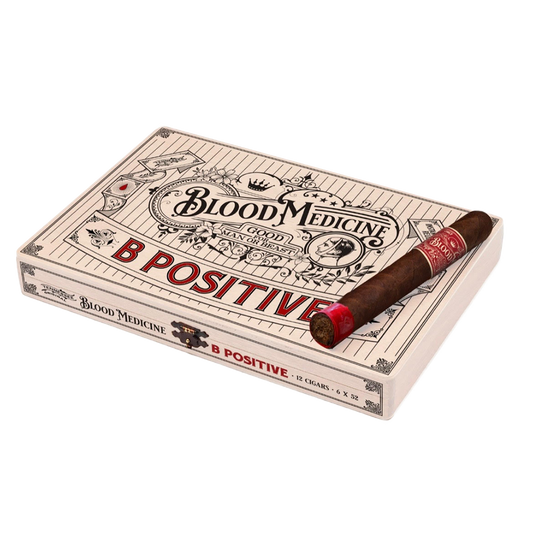 Cigar box labeled 'Blood Medicine B Positive' with a single cigar on a white background