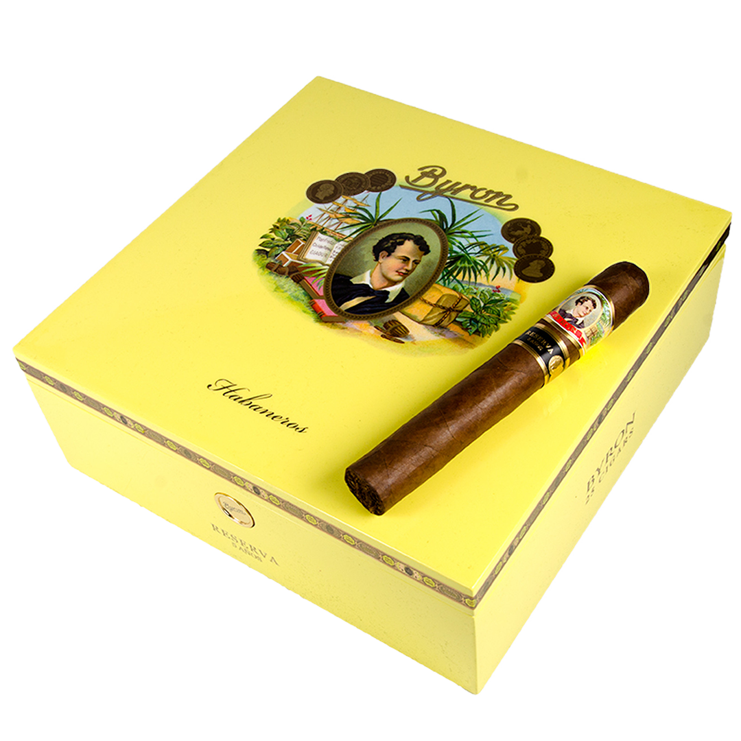 Cigar box with a cigar on top, featuring a decorative label with a portrait and cigars.