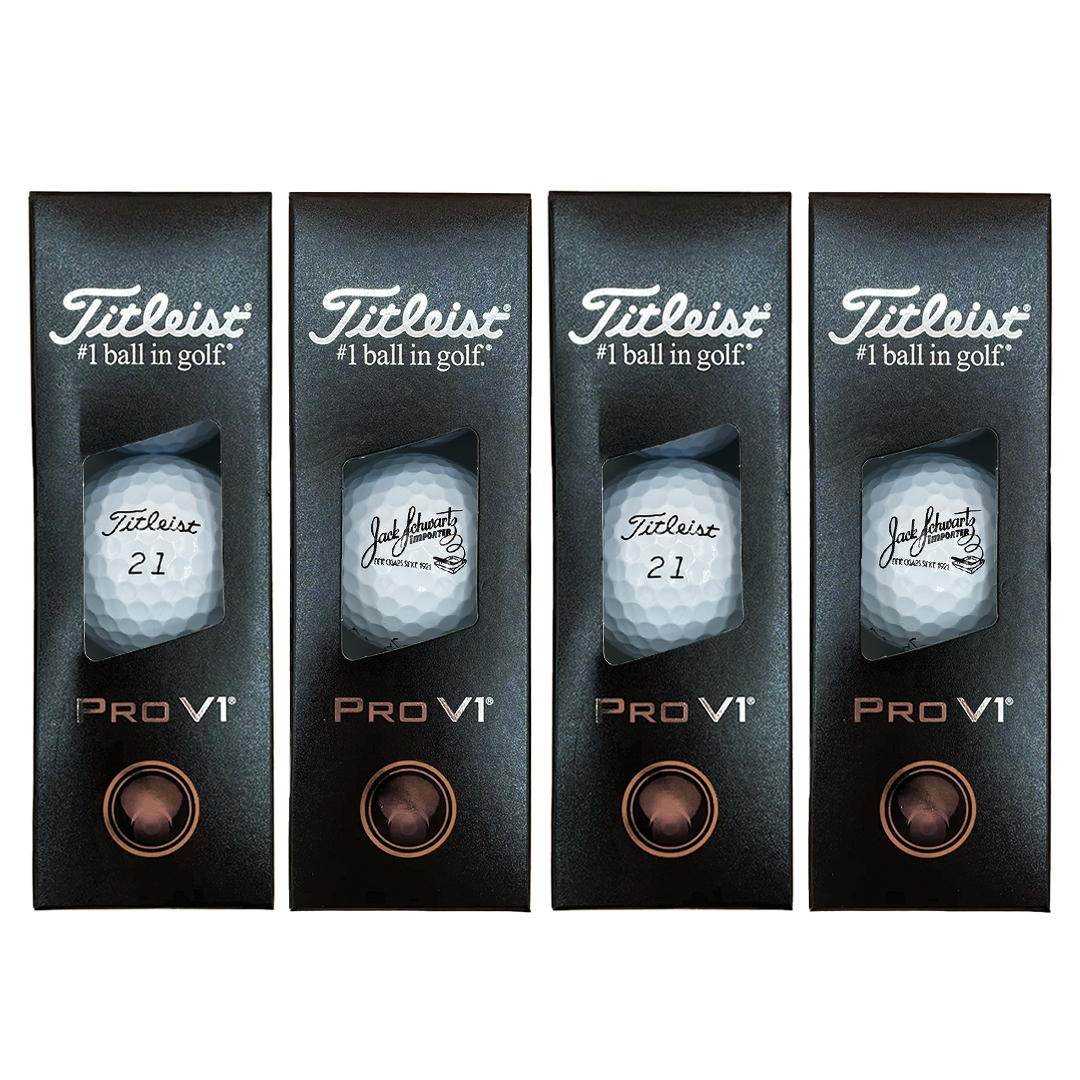 Four Titleist Pro Vi golf balls in packaging on a white background