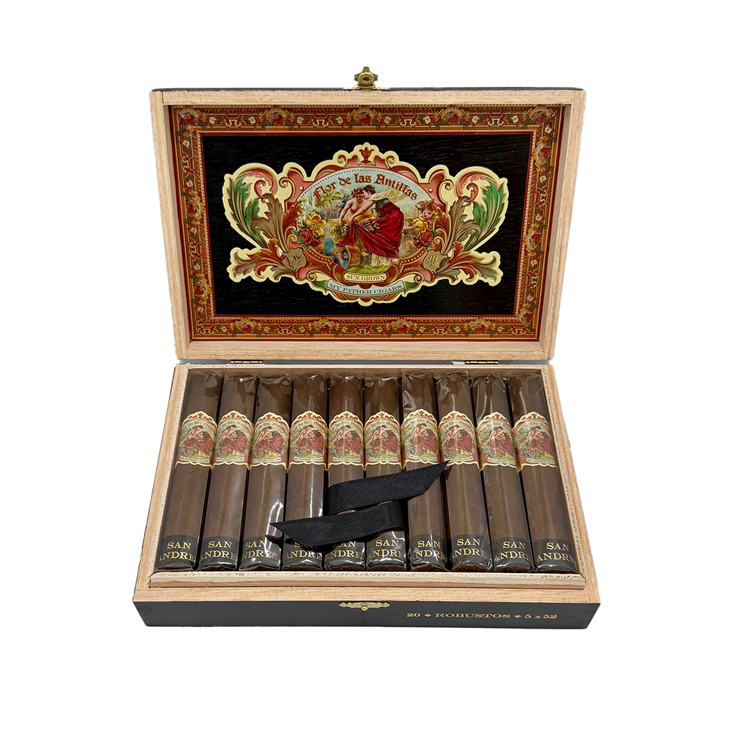 Open cigar box with cigars and a decorative lid on a white background