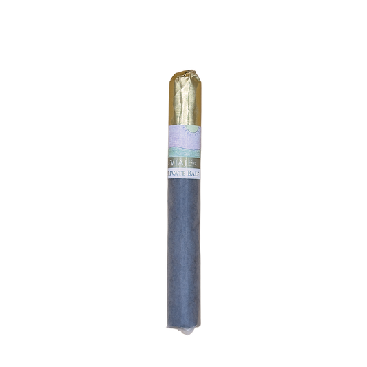 Cigar with a blue wrapper and gold band on a white background